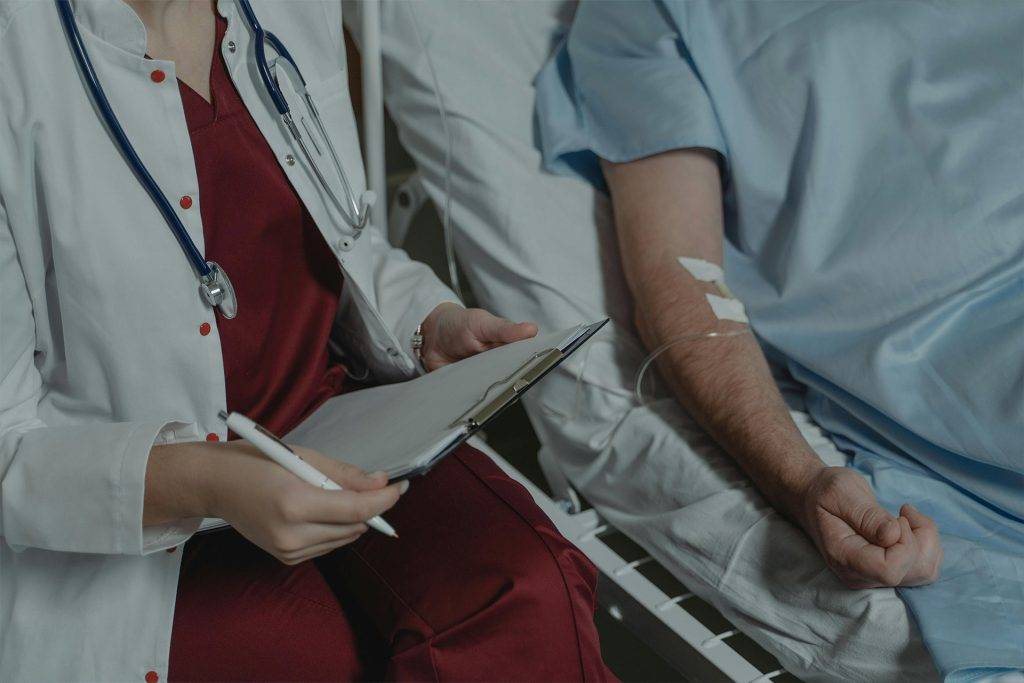 a male patient being seen by a nurse after an accident in Bakersfield