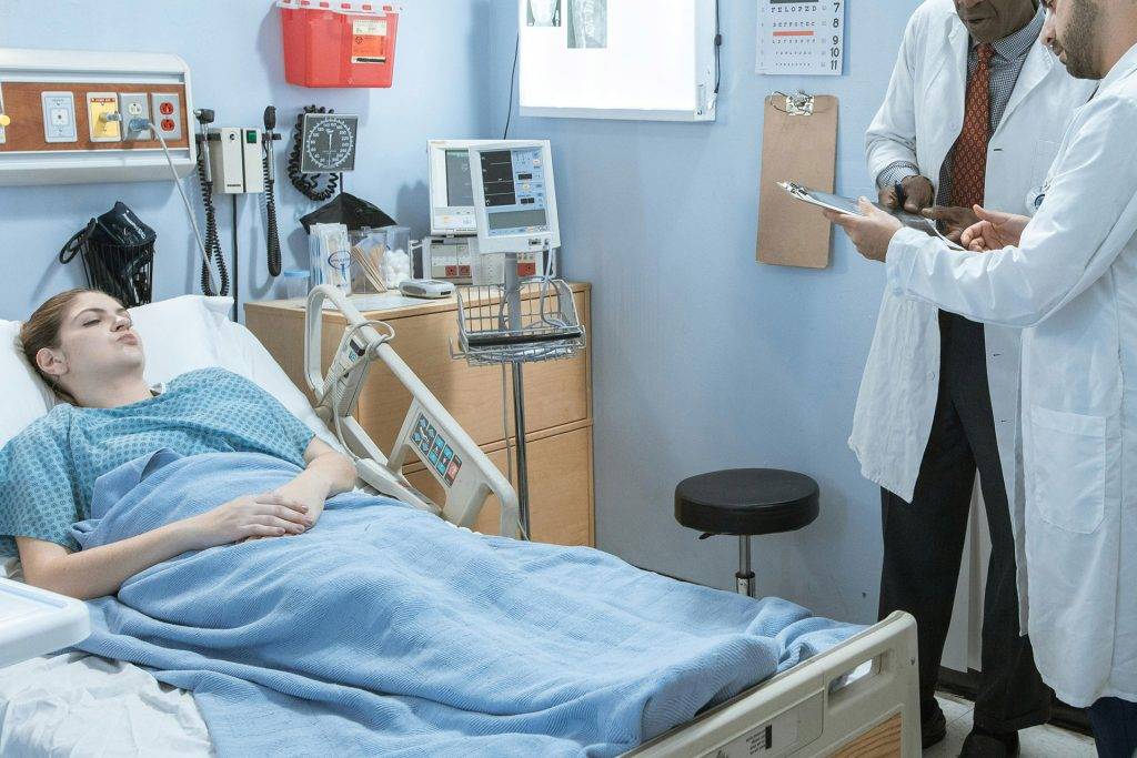 a female patient in a hospital bed after an accident in Sacramento