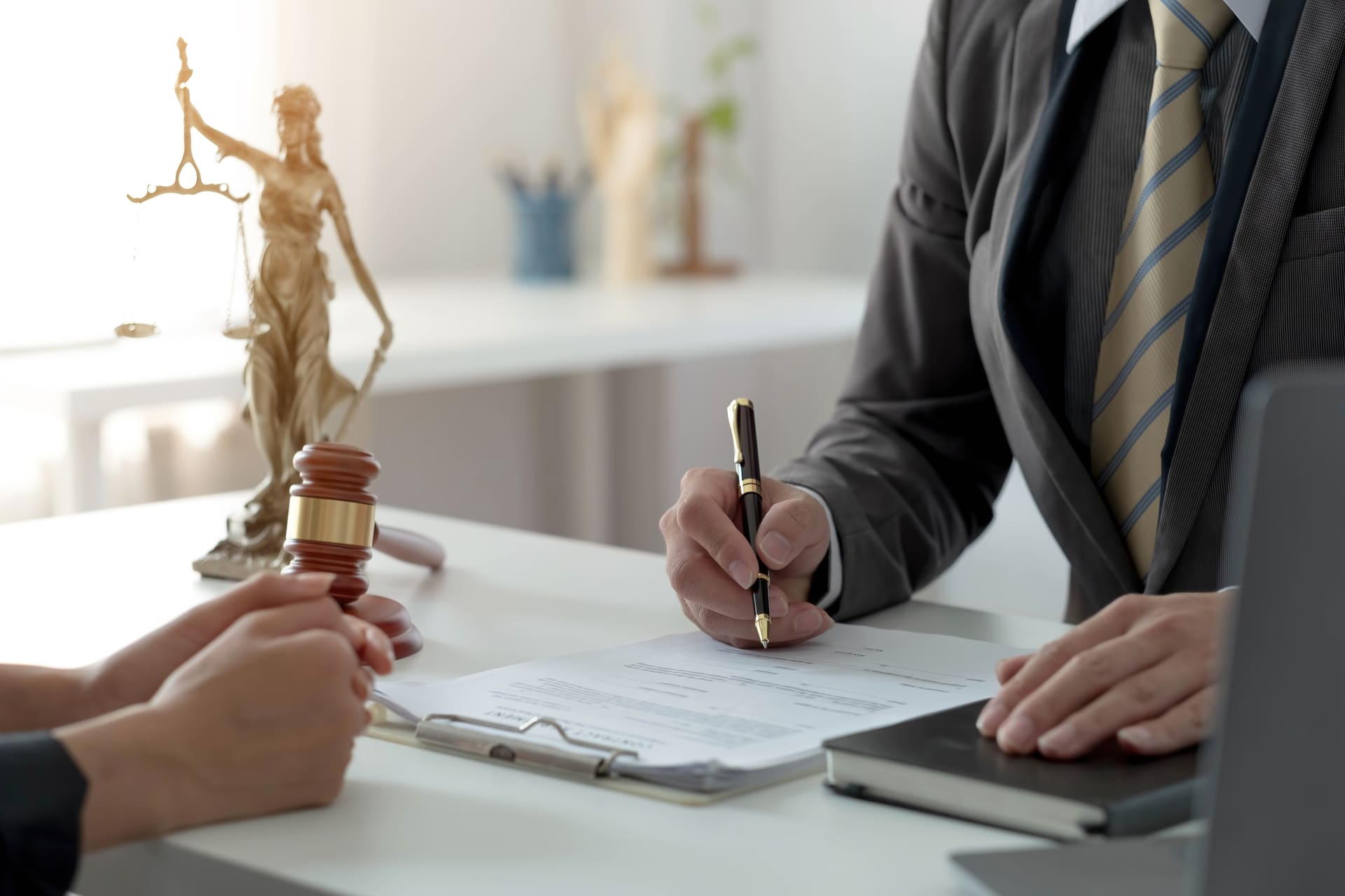 Attorney discussing a legal case with a client at the office