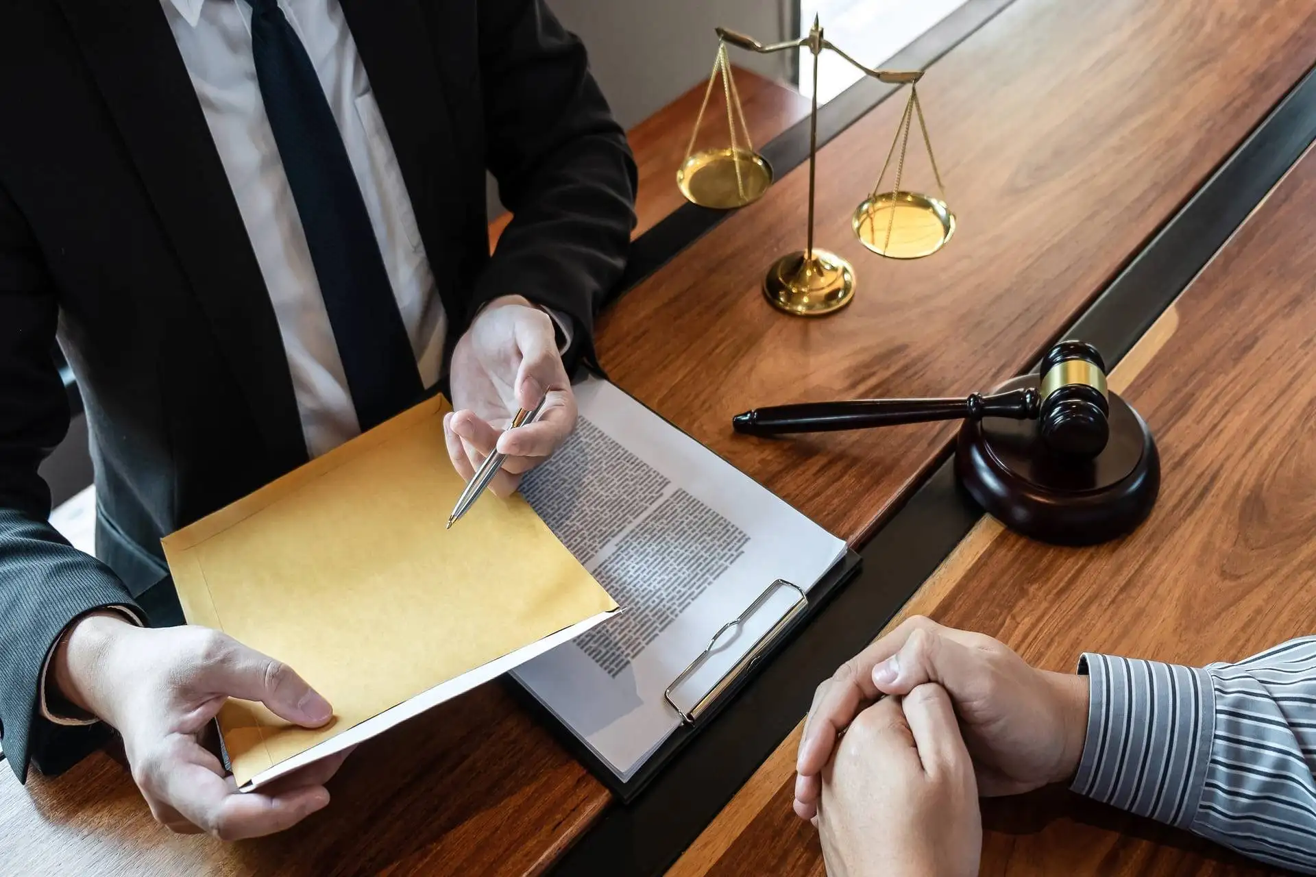 Attorney presenting legal documents during client consultation