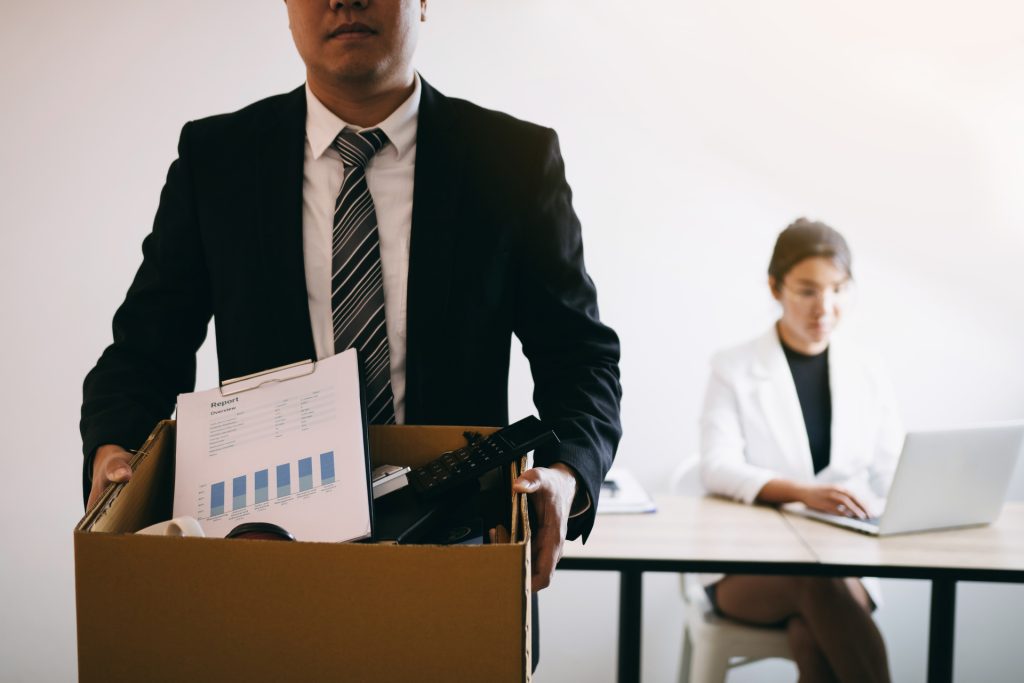 Fired man with box