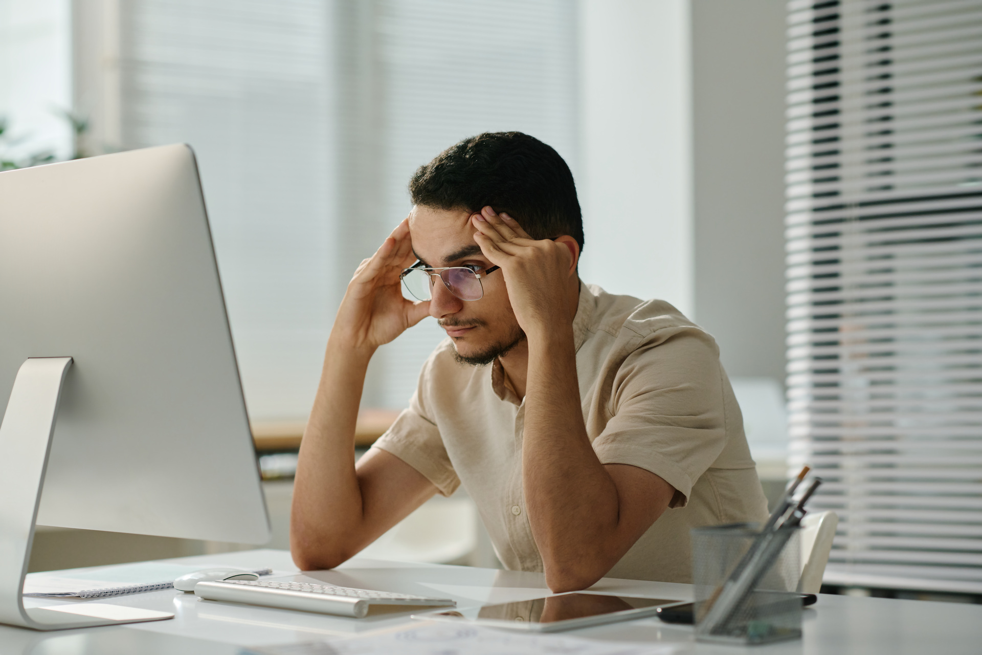 Worried man working at computer