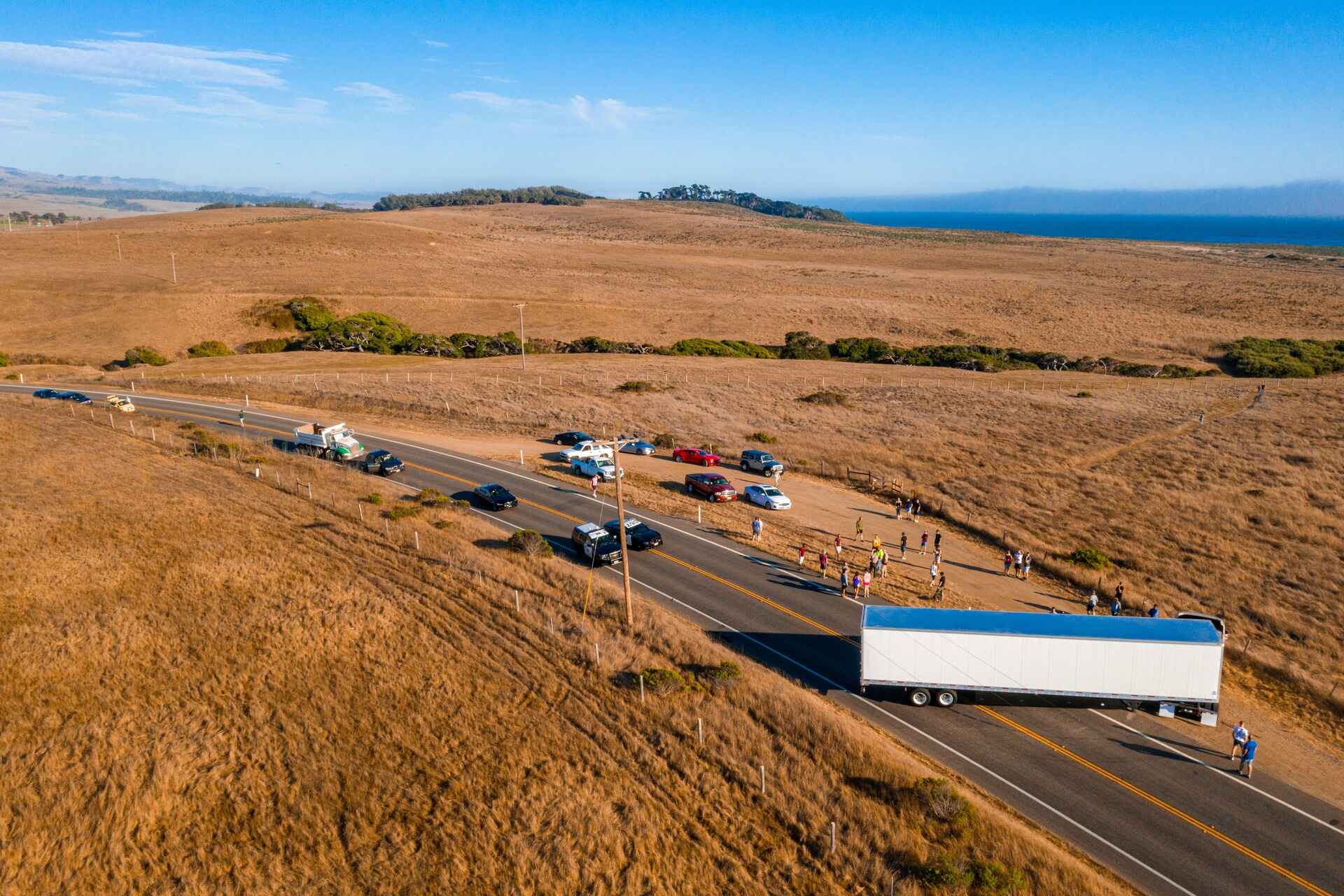 aerial shot of vehicles and people on the highway