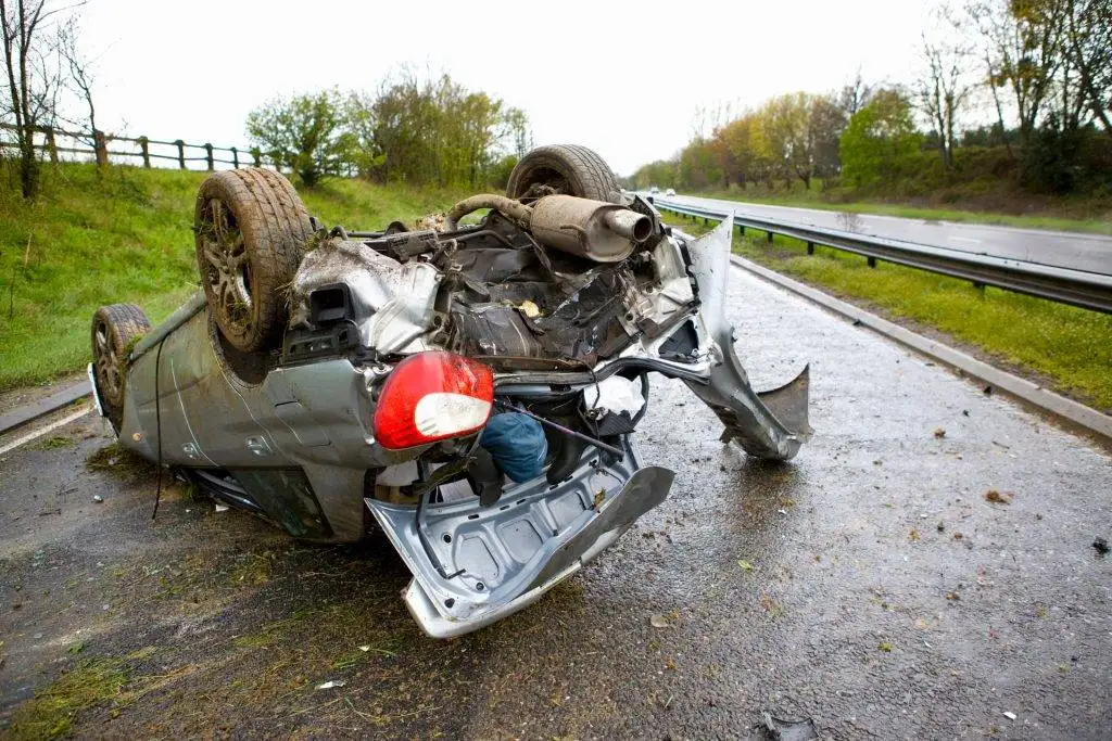 closeup photo of a car on its head
