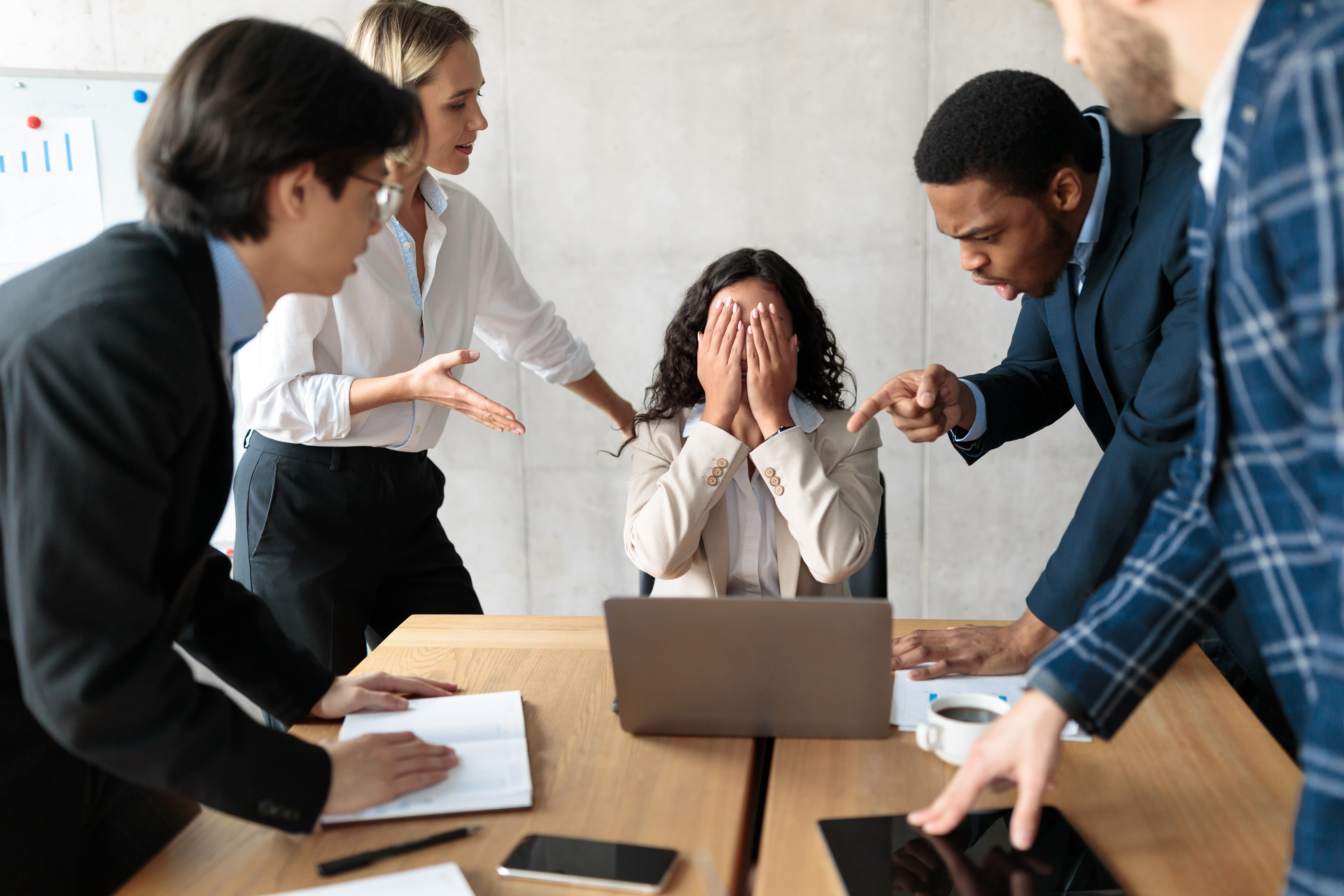 displeased business people shouting at unhappy female