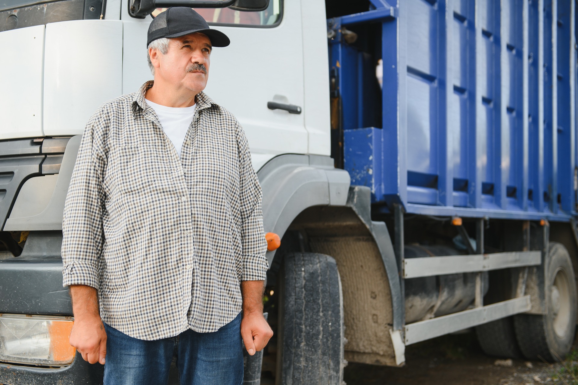 driver is standing near the truck