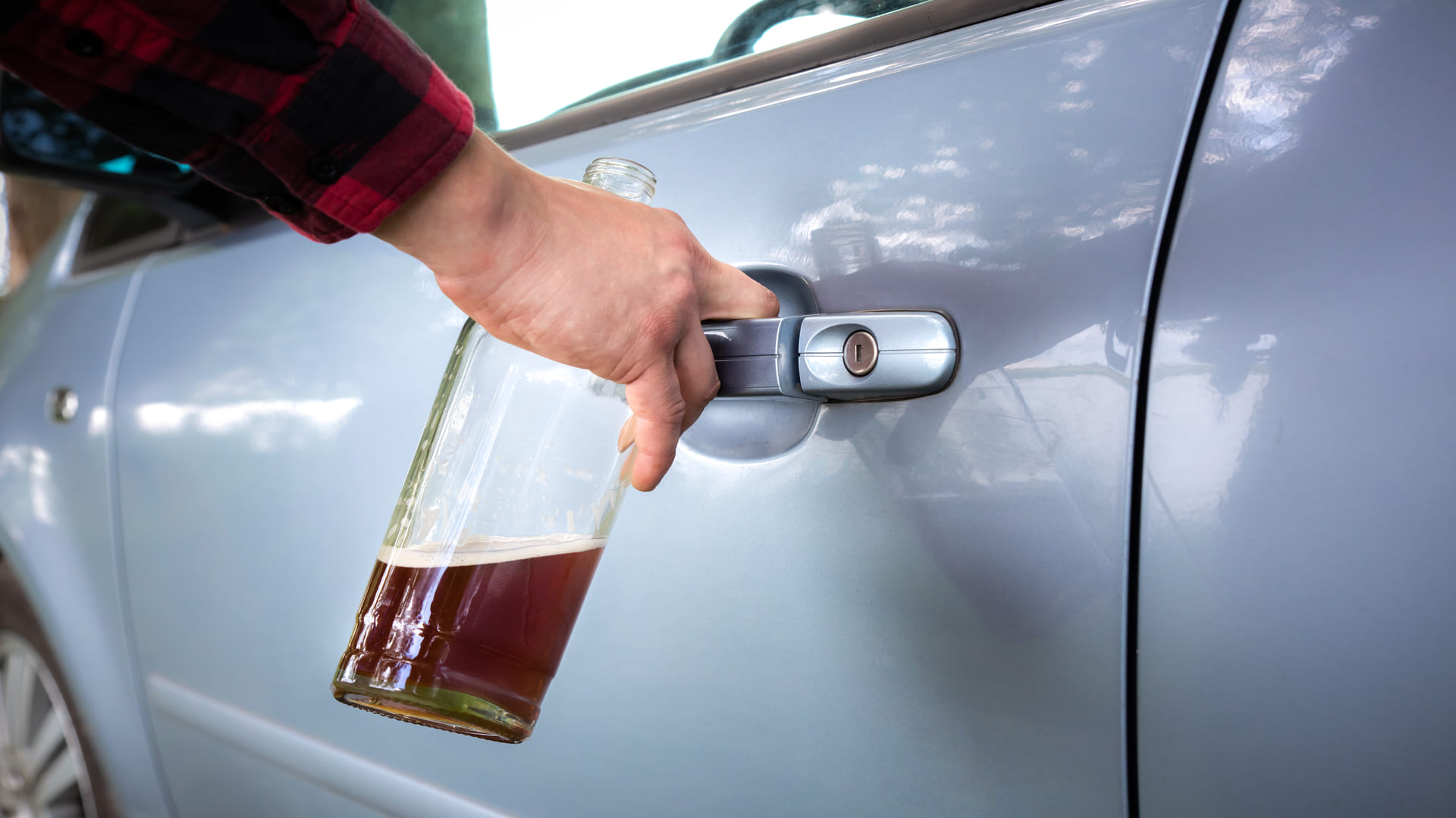Image of drunk drive opening car door
