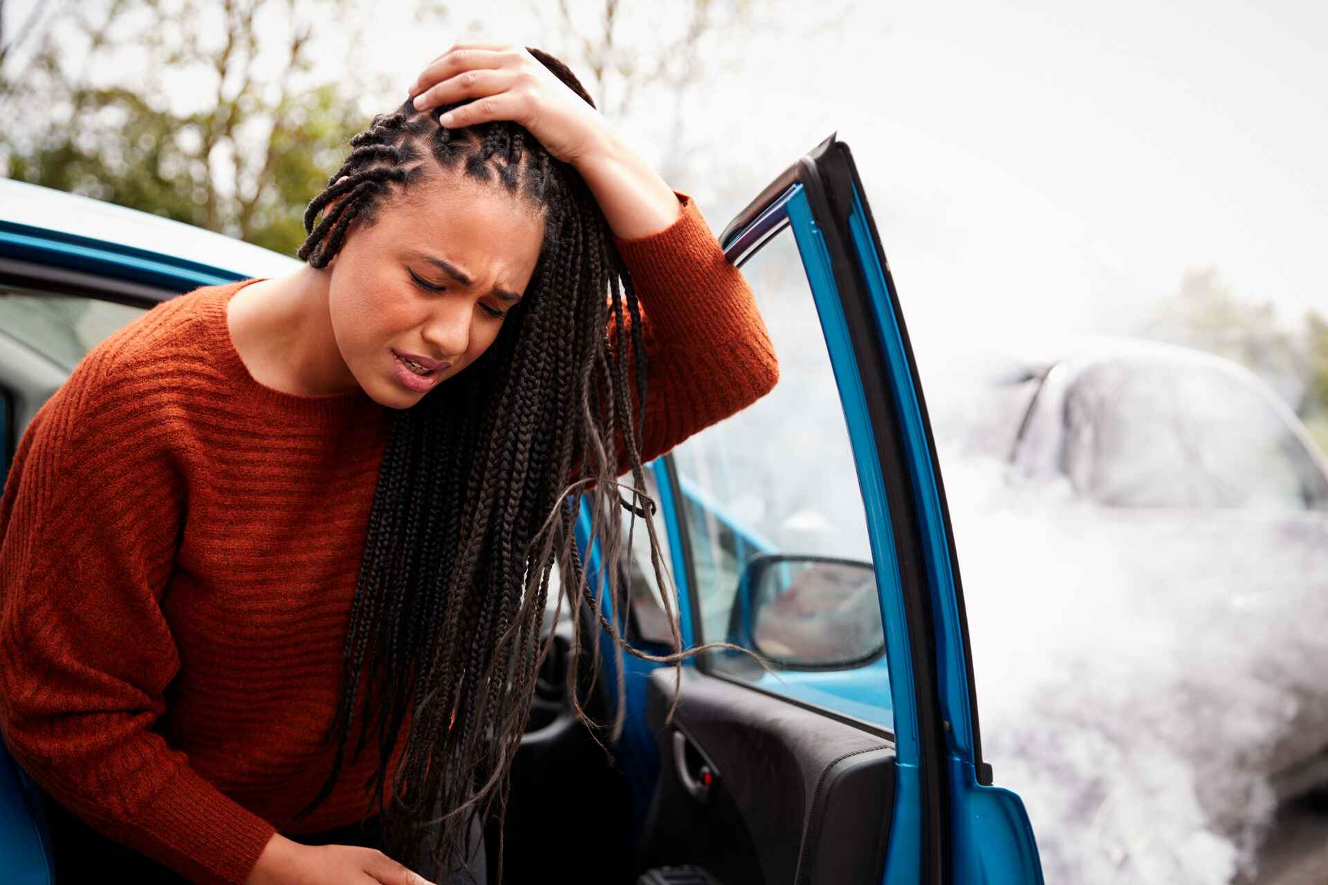 female with head injury getting out of car