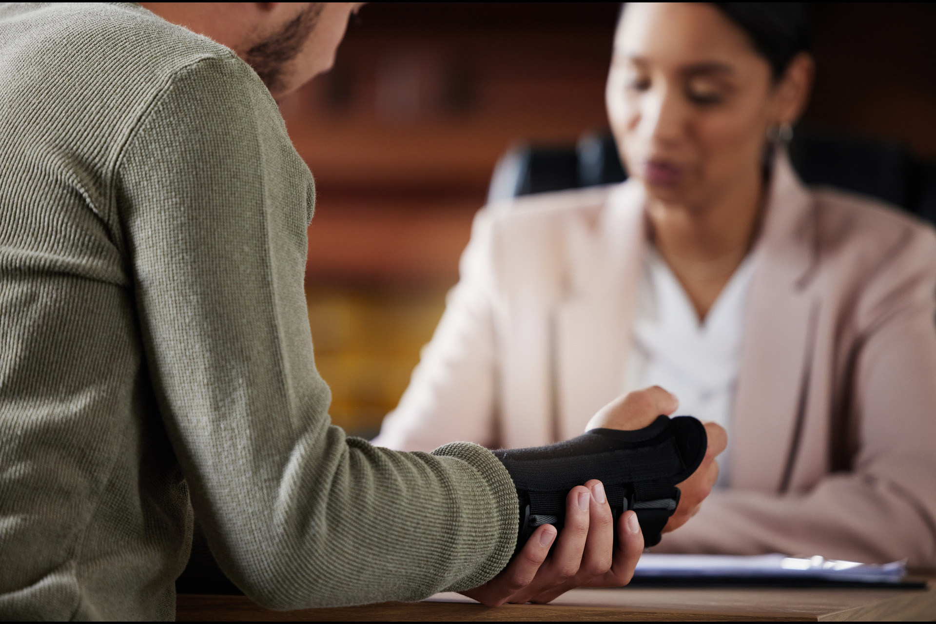 man with hand injury and lawyer