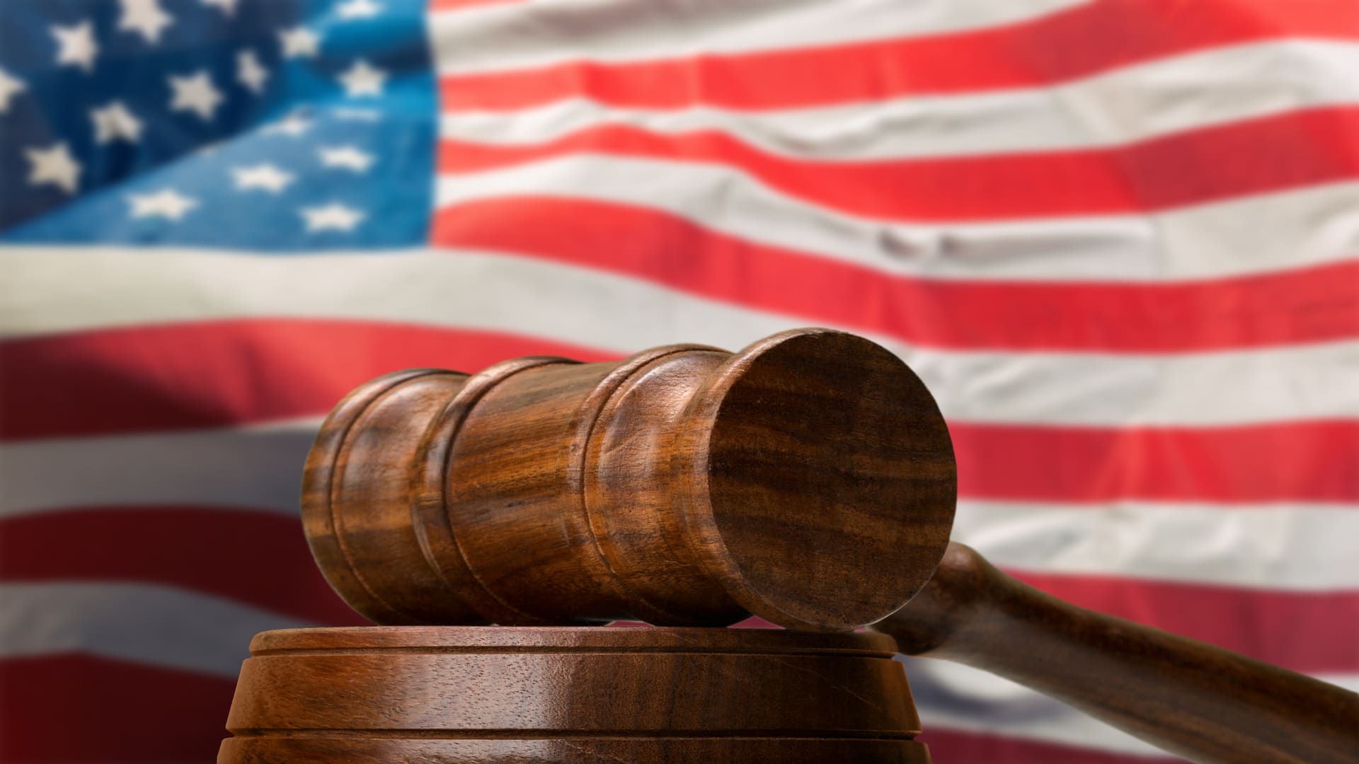 Justice system symbol and american flag