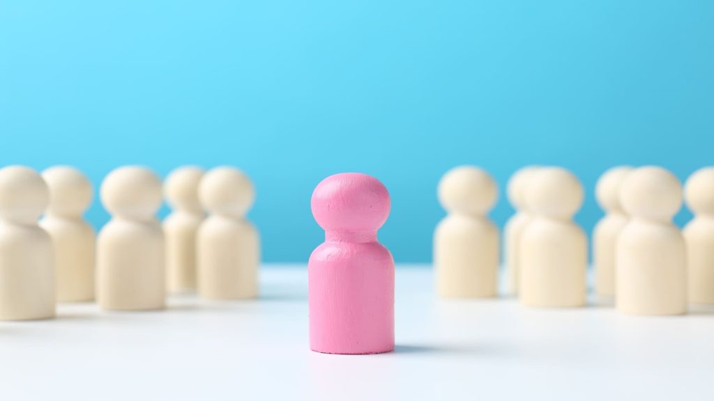 Pink figure separated from white figures