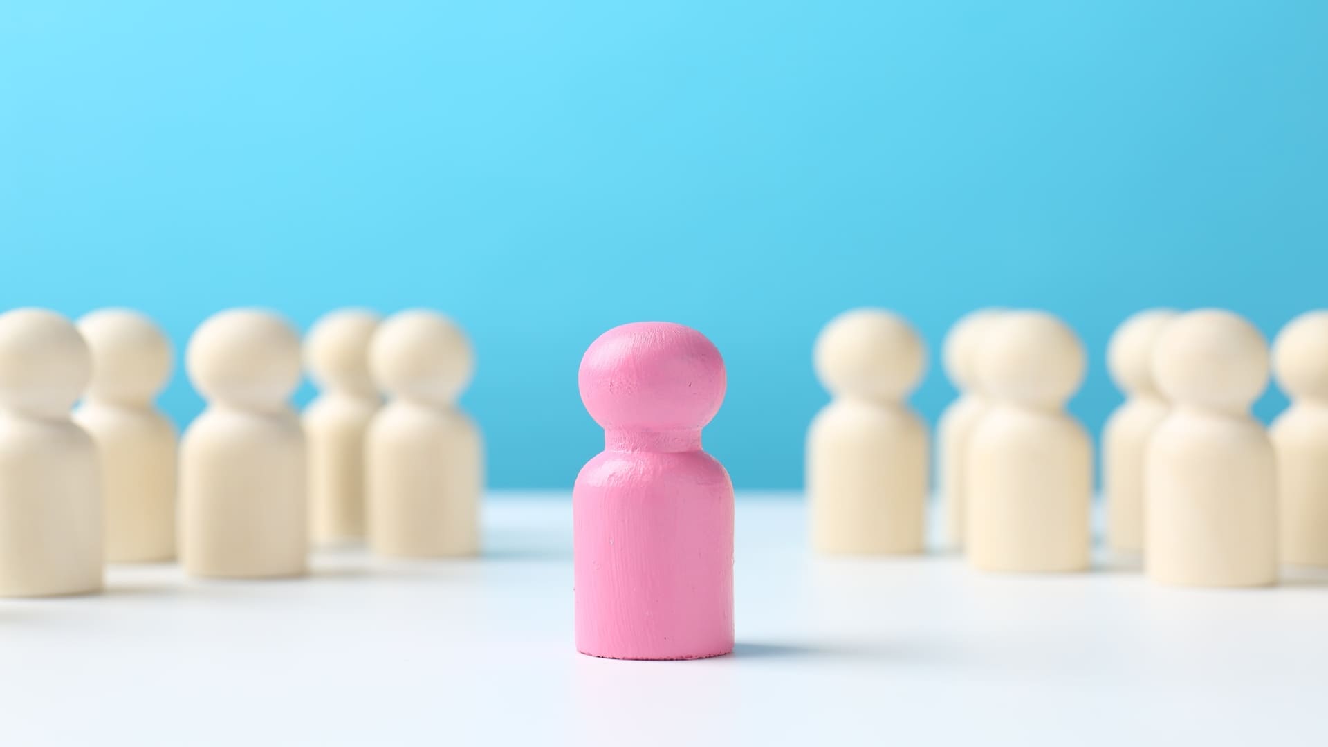 Pink figure separated from white figures