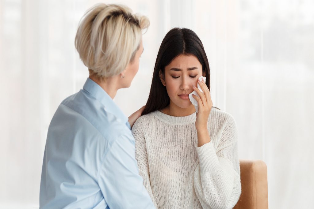 psychologist comforting unhappy wife