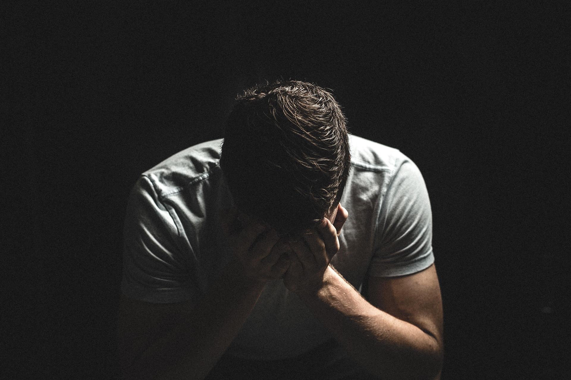 sad guy in the dark