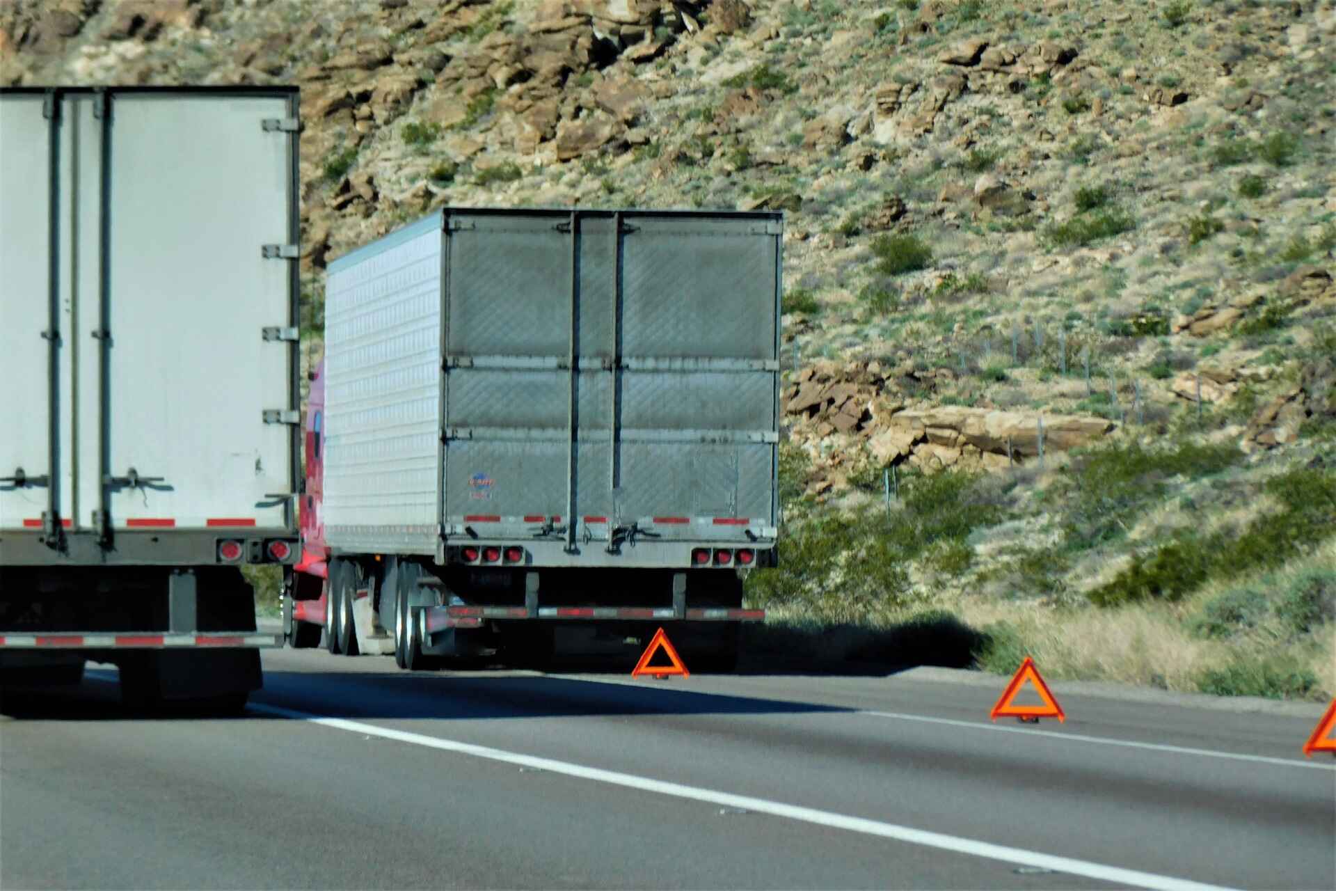 two trucks on road