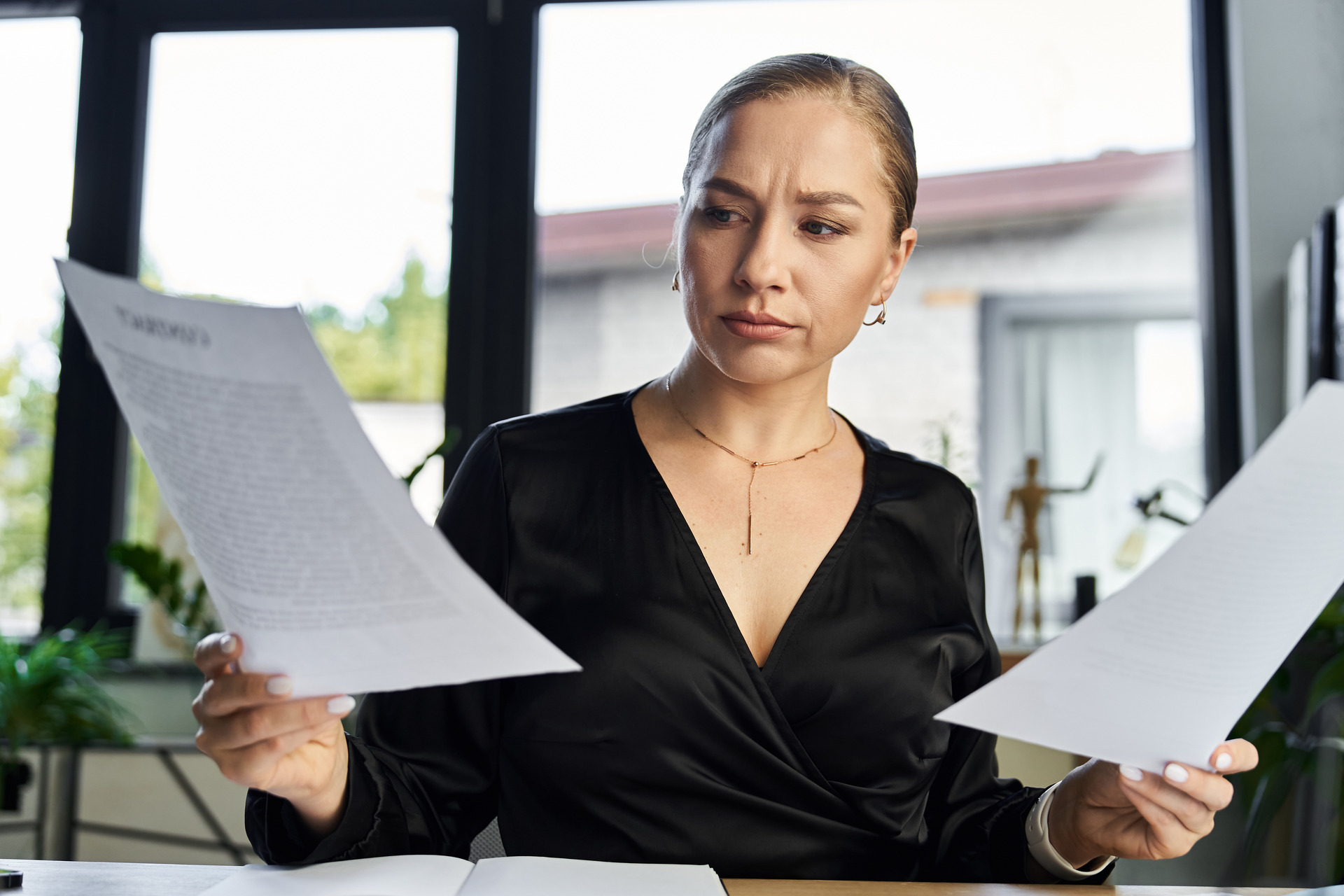 woman carefully reviewing document