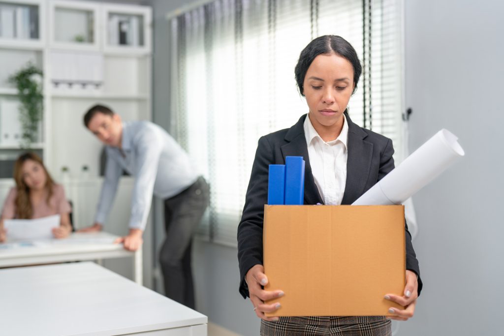 woman office worker feel sad carrying cardboard box