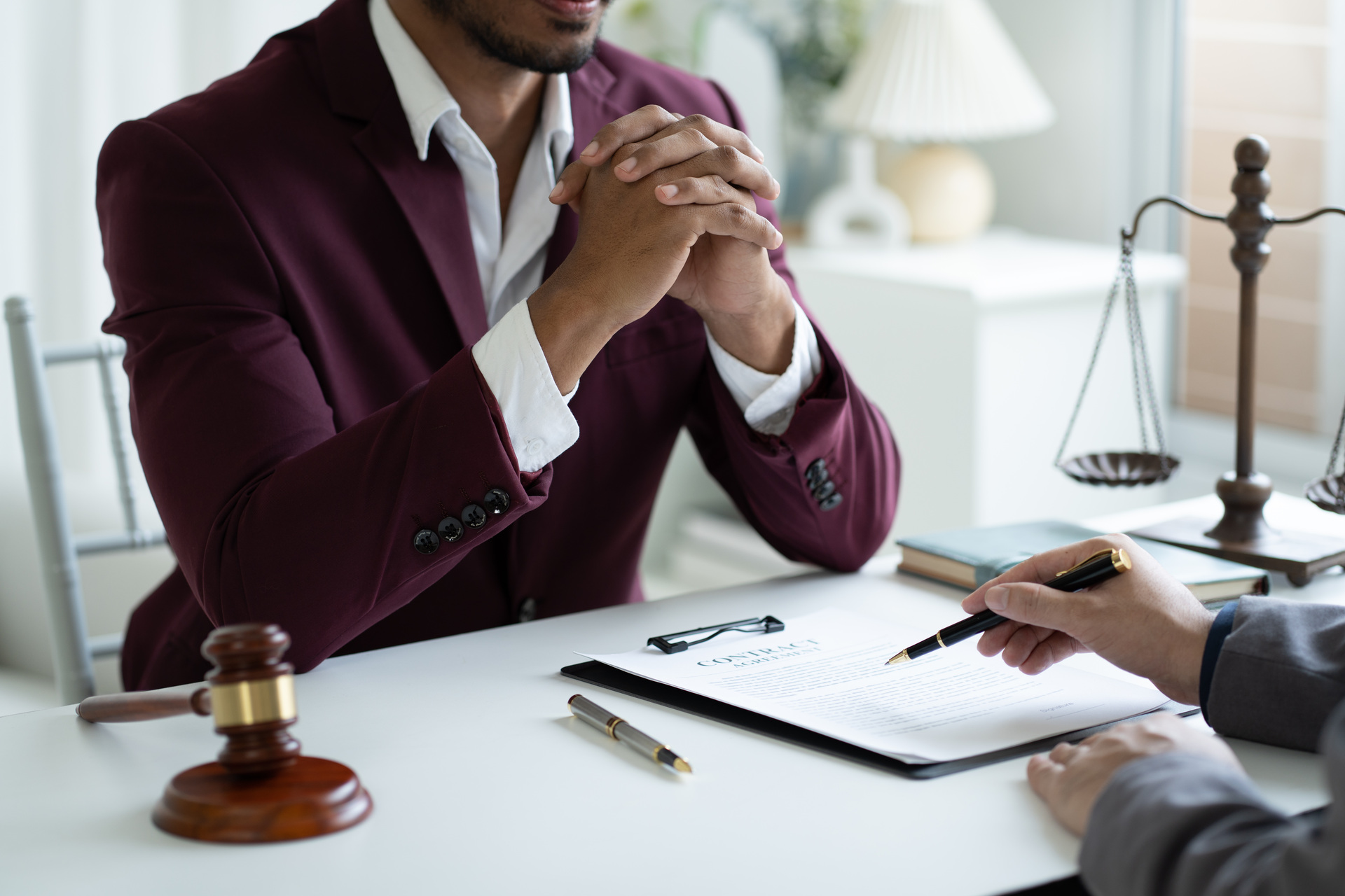 young professional lawyer consulting with his client